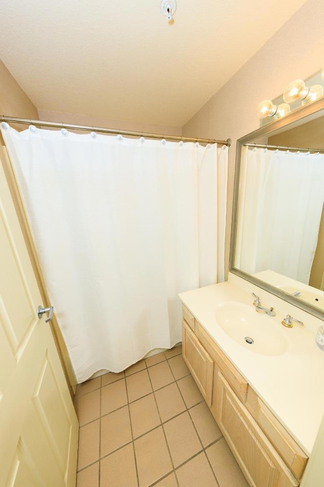 bathroom with vanity and tile patterned floors