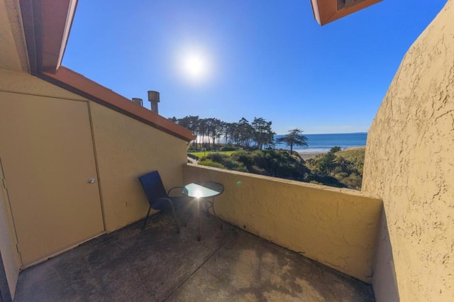 balcony featuring a water view