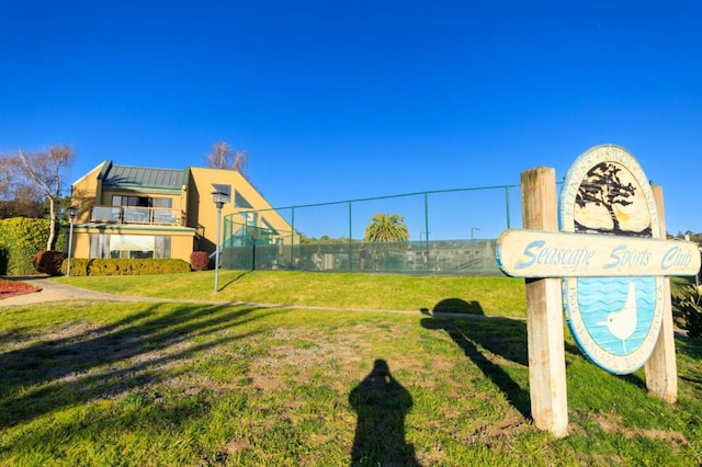 view of property's community with a lawn