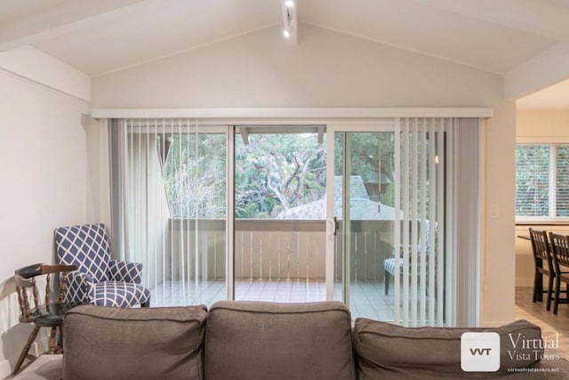 interior space featuring vaulted ceiling with beams