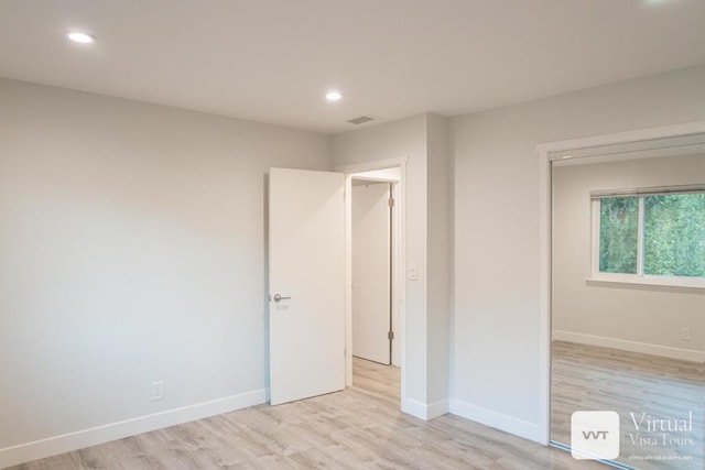 unfurnished bedroom featuring light hardwood / wood-style floors