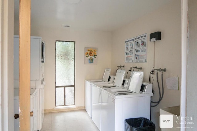 clothes washing area featuring washing machine and dryer