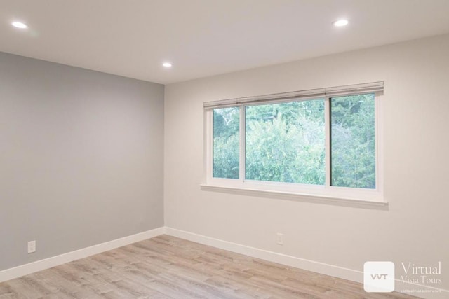 unfurnished room featuring light wood-type flooring