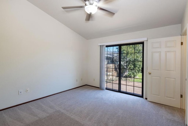 carpeted spare room featuring ceiling fan