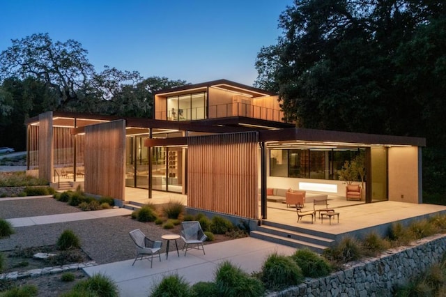 exterior space featuring a balcony and a patio area