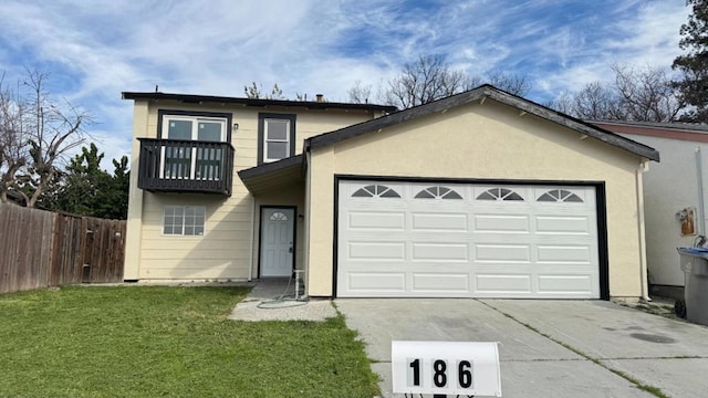 view of front of house featuring a garage, a balcony, and a front yard