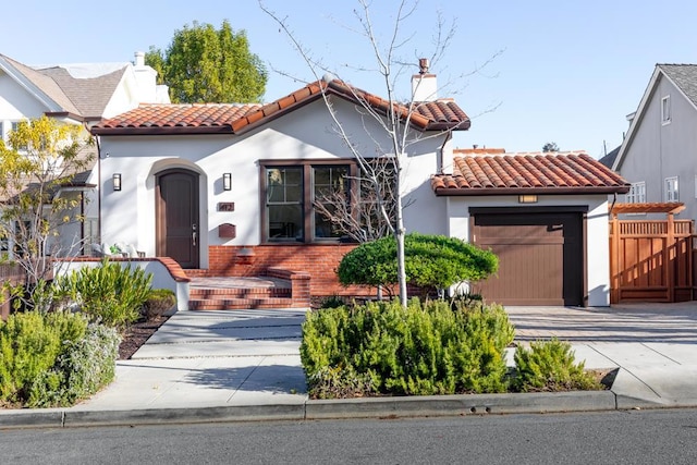 mediterranean / spanish-style house featuring a garage