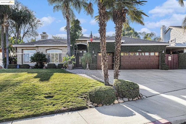 view of front facade with a garage and a front yard