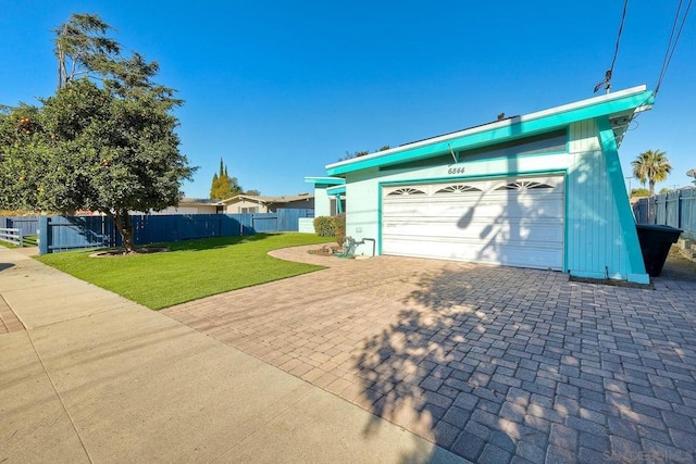 garage with a yard