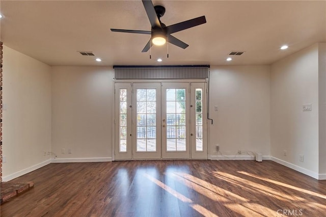 doorway featuring dark wood-type flooring and ceiling fan