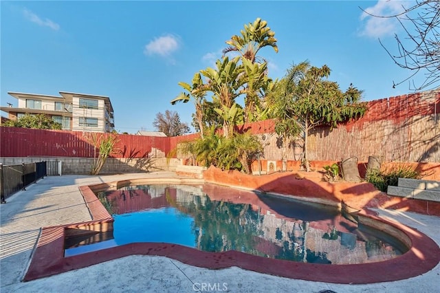 view of swimming pool with a patio