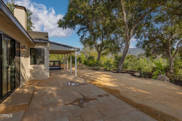 view of patio / terrace featuring a mountain view