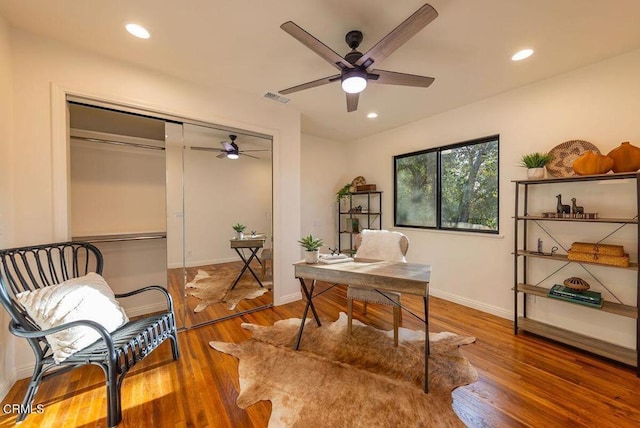 office space featuring hardwood / wood-style floors and ceiling fan