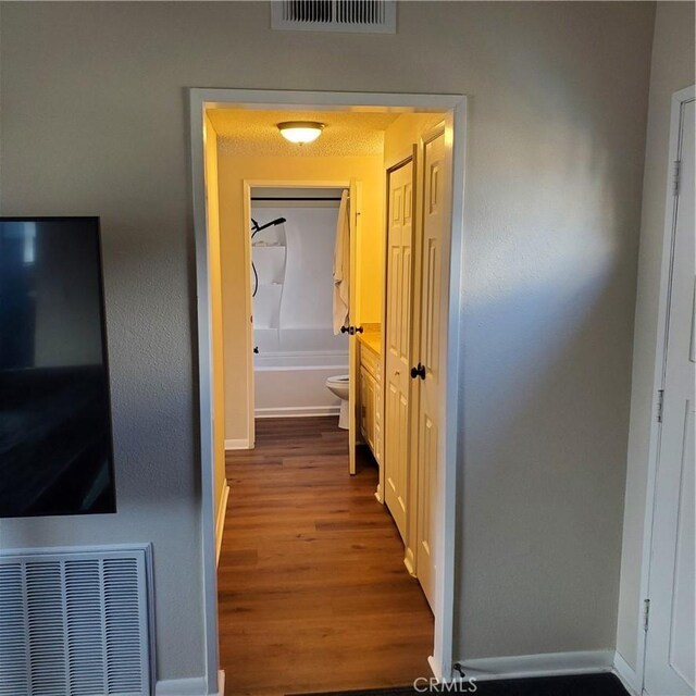 hall featuring hardwood / wood-style flooring