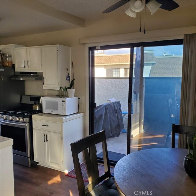 kitchen featuring white cabinetry, stainless steel range with gas cooktop, and plenty of natural light