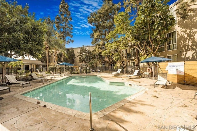 view of pool featuring a patio