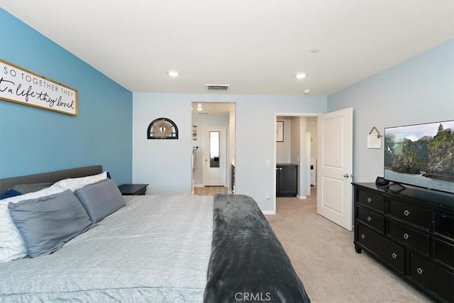 bedroom with light carpet, baseboards, and visible vents