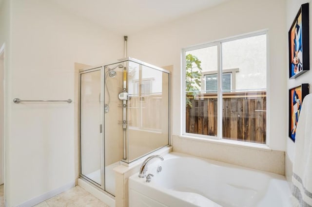 bathroom featuring independent shower and bath