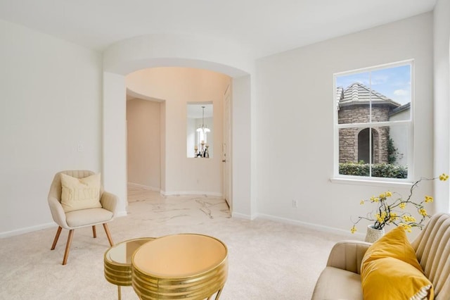 living area with carpet flooring and a wealth of natural light