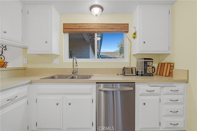 kitchen featuring white cabinets, sink, and dishwasher