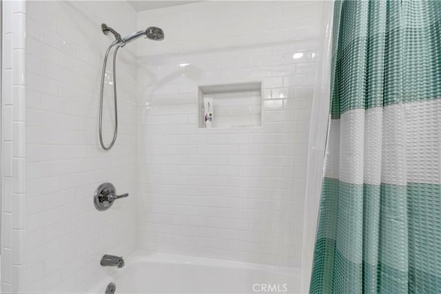 bathroom with shower / tub combo with curtain