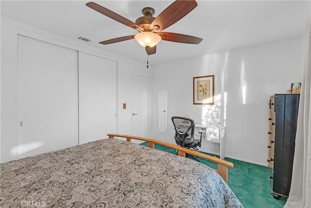 unfurnished bedroom with a closet, ceiling fan, and dark colored carpet