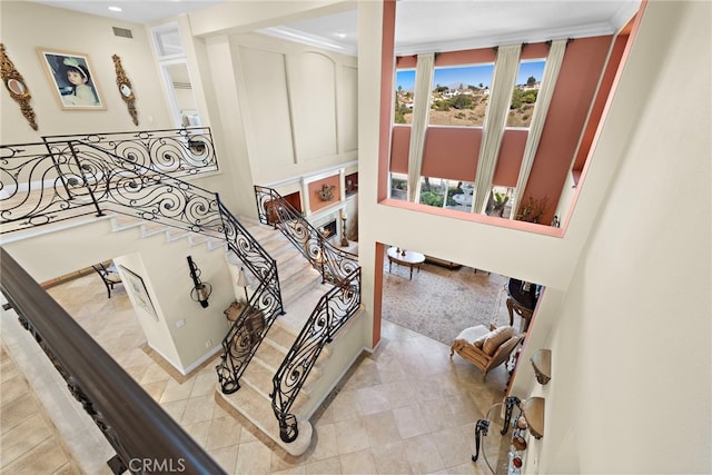 staircase with crown molding