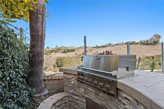 view of patio / terrace featuring area for grilling and grilling area