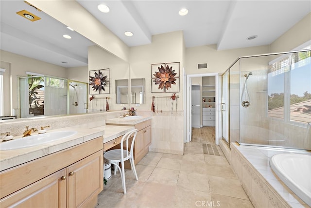 bathroom with vanity, shower with separate bathtub, and tile patterned floors