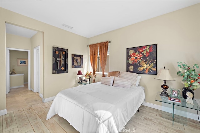 bedroom with light hardwood / wood-style flooring