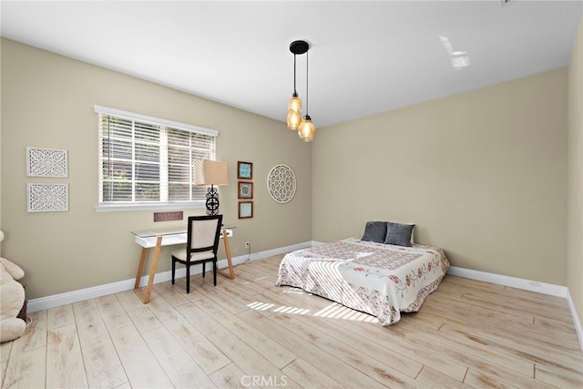 bedroom with light hardwood / wood-style flooring