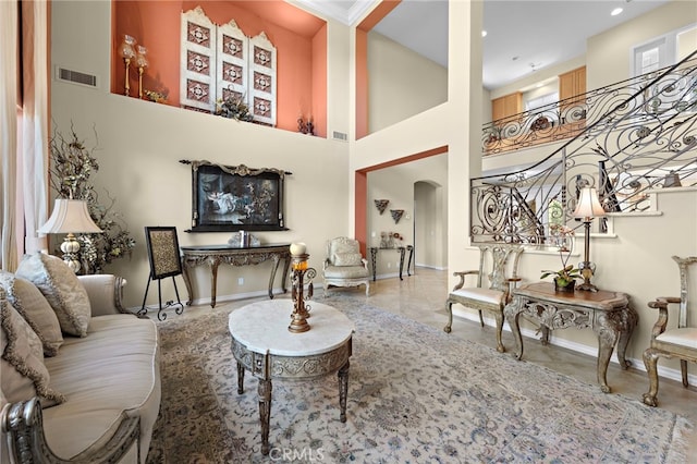 living room with a high ceiling