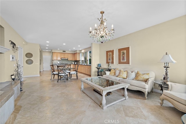 living room with an inviting chandelier