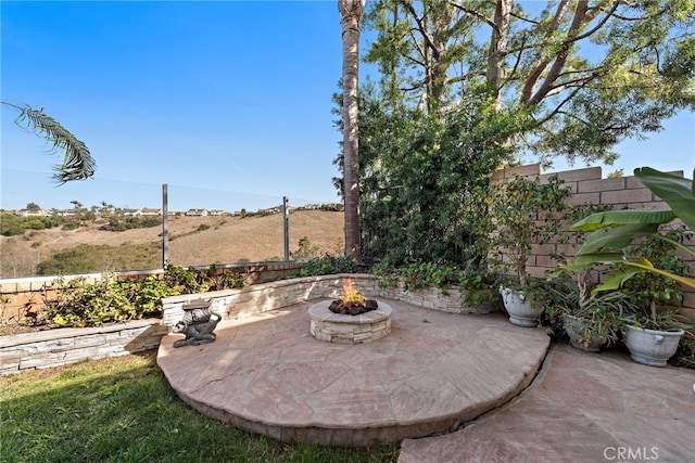 view of patio / terrace with a fire pit