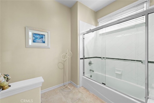 bathroom featuring shower / bath combination with glass door and tile patterned flooring