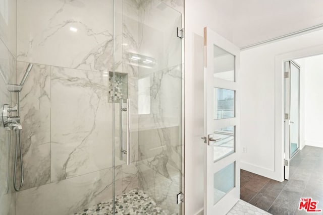 bathroom featuring an enclosed shower