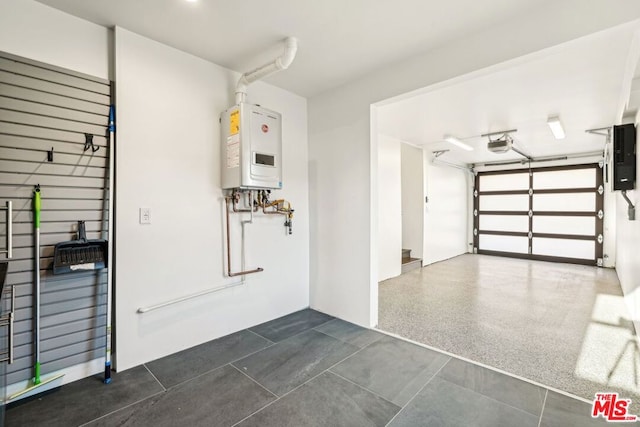 garage with tankless water heater and a garage door opener