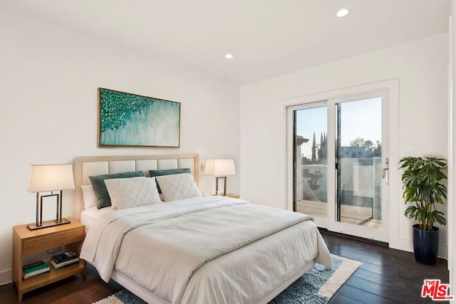 bedroom featuring dark hardwood / wood-style flooring and access to outside