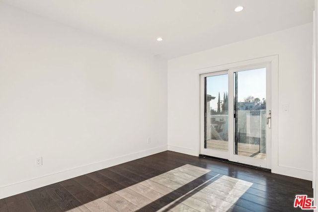 empty room featuring dark hardwood / wood-style floors