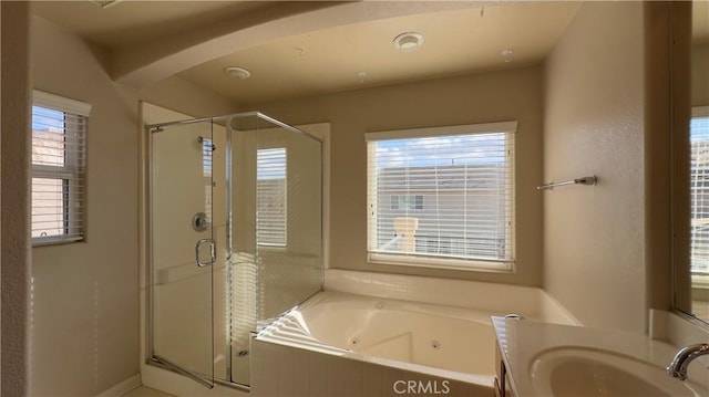 bathroom featuring vanity and plus walk in shower