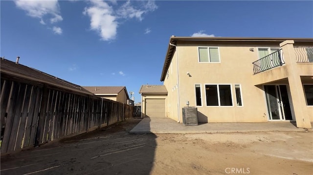 exterior space featuring a garage and central air condition unit