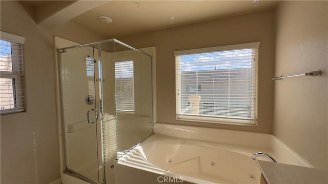 bathroom with separate shower and tub and a healthy amount of sunlight