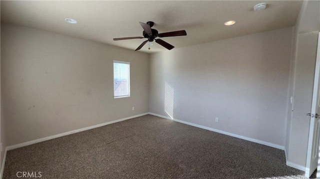 carpeted empty room featuring ceiling fan