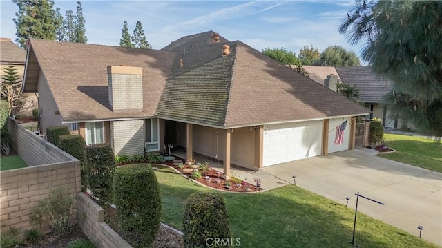 view of front of house with a garage and a front yard