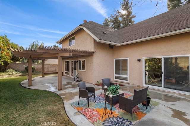 rear view of house with a yard, a pergola, and a patio area