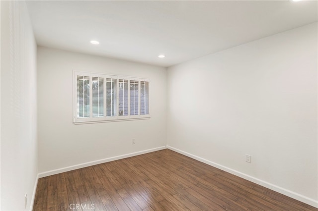 unfurnished room featuring wood-type flooring