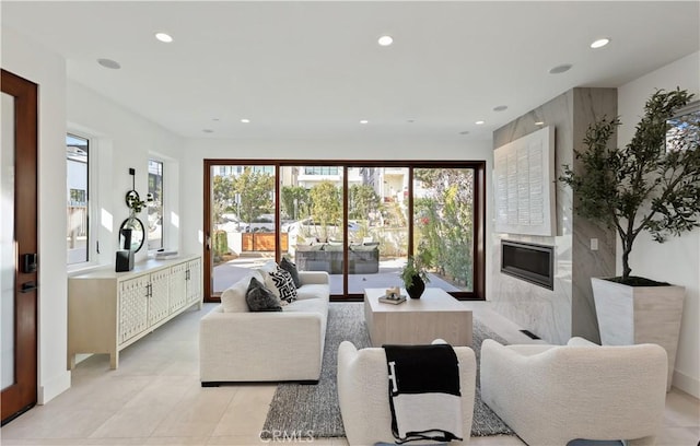 living room with a high end fireplace