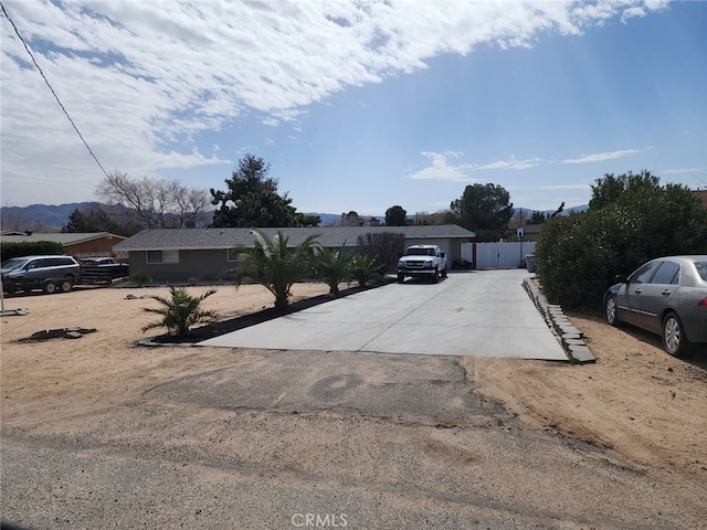 view of front of house featuring fence