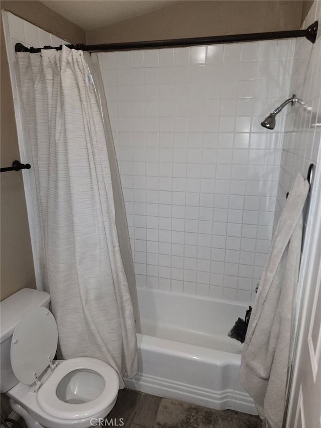 full bath featuring shower / tub combo and toilet