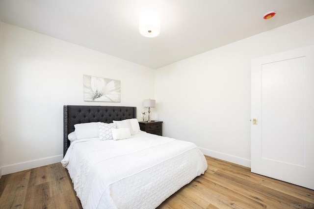 bedroom with hardwood / wood-style floors